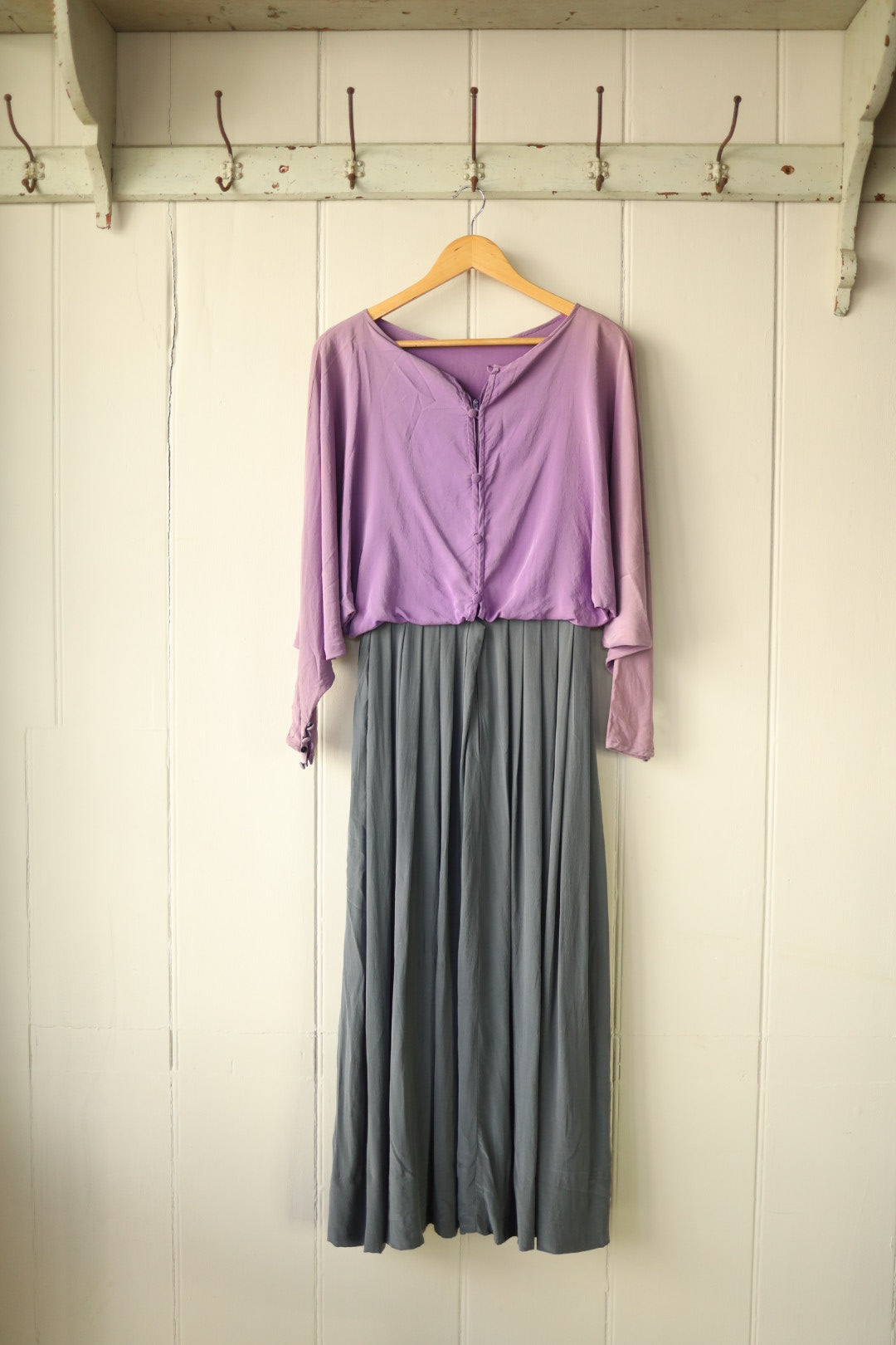 Back view of the John Bates silk dress showing silk-covered buttons running from waist to neckline over a concealed zip.