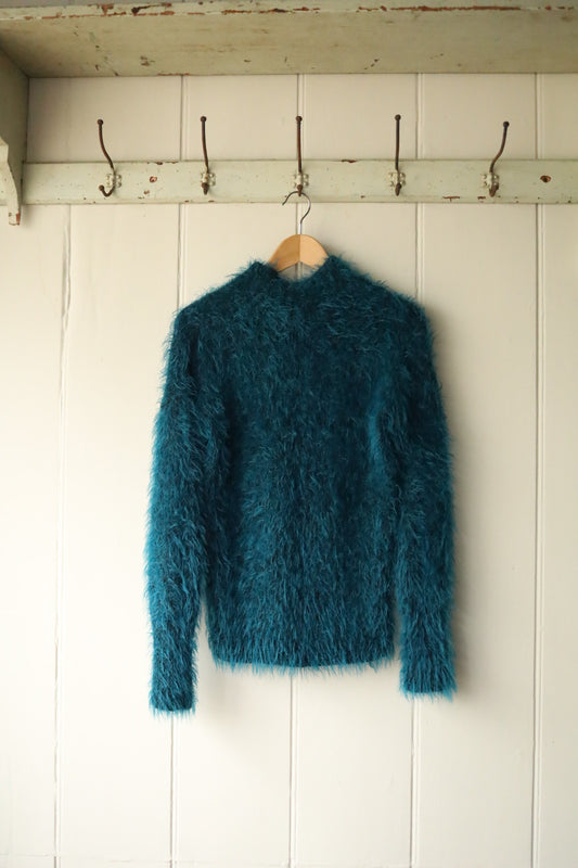 Tufted hand knitted turtle neck