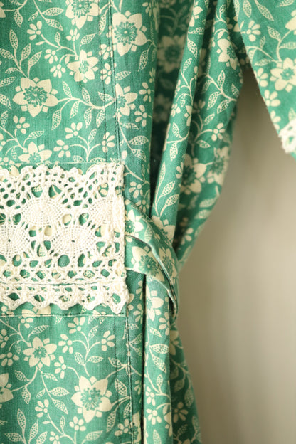 Close-up of waist lace trim and floral fabric pattern