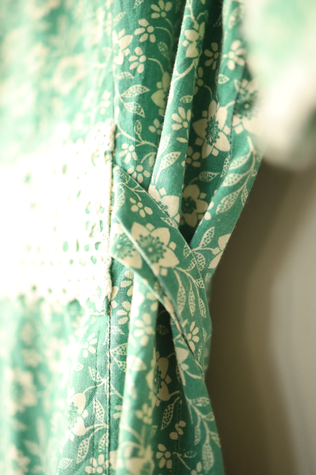 Side view showing waist tie placement and lace panel overlap