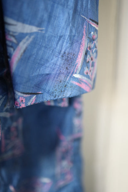 Detailed image of sleeve edge showing mild fading and surface wear on the print.
