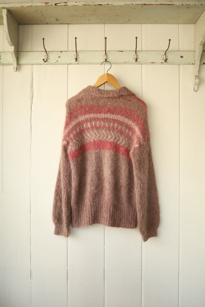 The cardigan shown from the back, highlighting the rounded intarsia pattern and soft brushed texture of the knit.