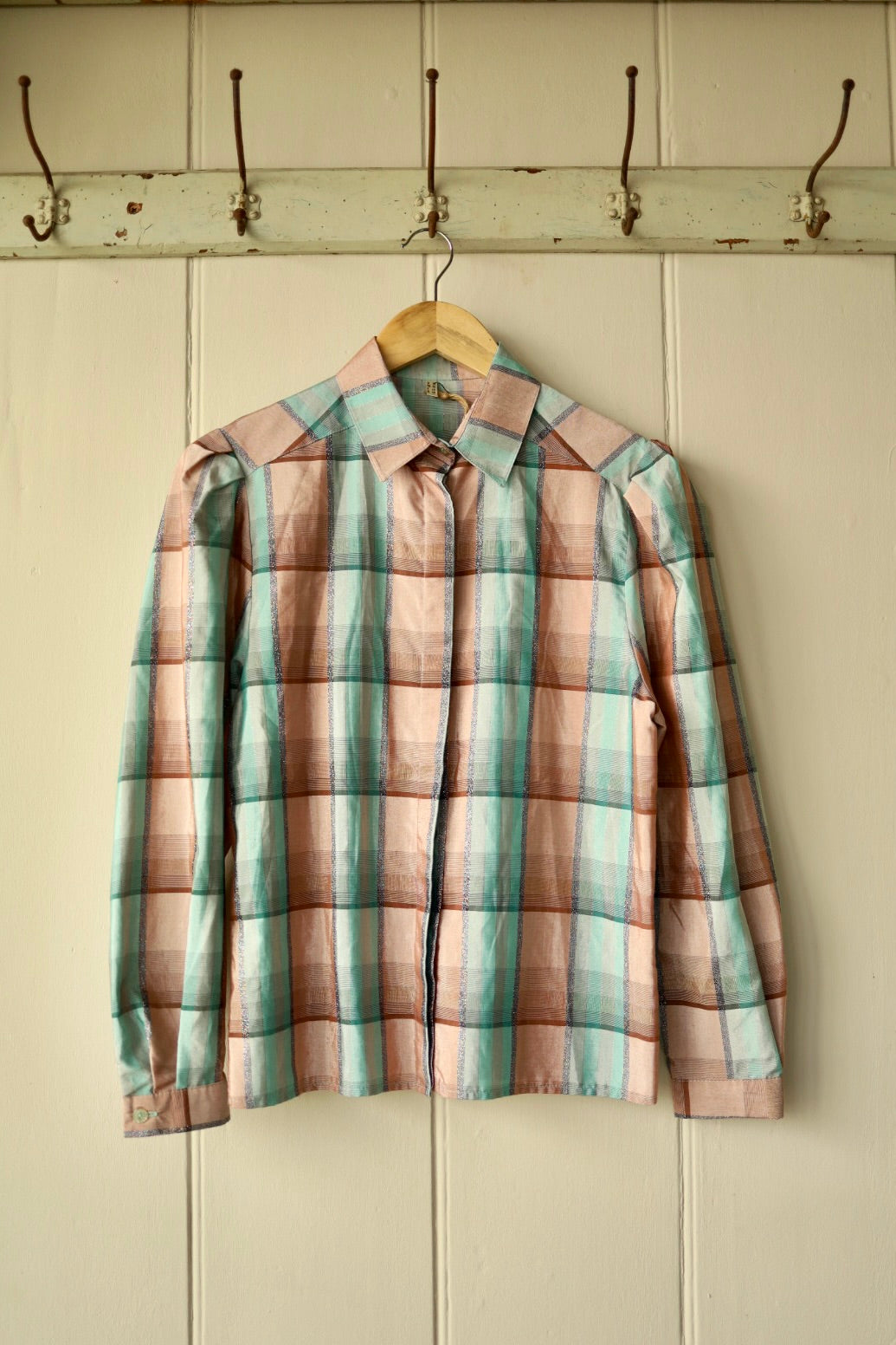 Front view of vintage pastel check blouse with mutton sleeves and concealed buttons