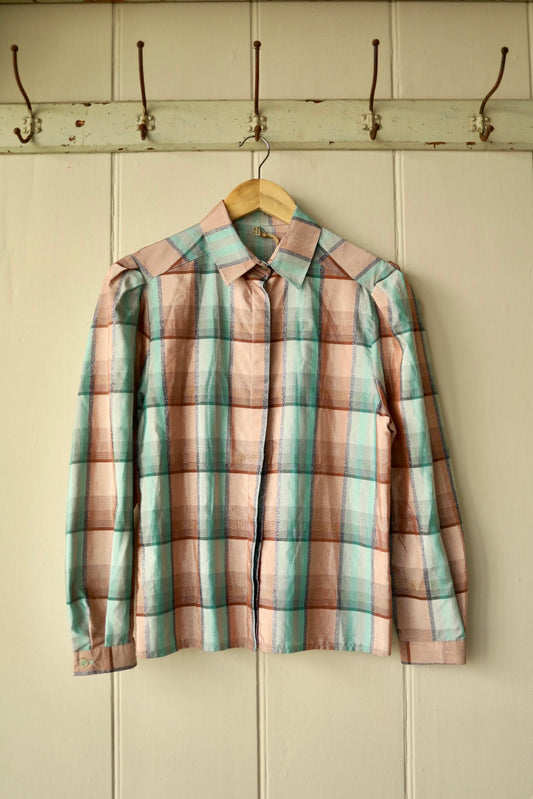 Front view of vintage pastel check blouse with mutton sleeves and concealed buttons