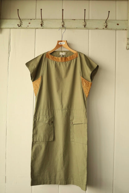 Close-up front view of the same khaki dress showing neckline and pocket detailing.